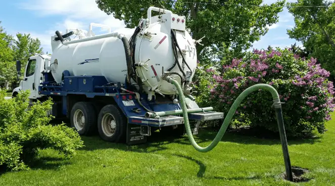 Professional vacuum truck performing residential drainage and septic maintenance in Tucson, AZ